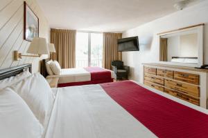 Säng eller sängar i ett rum på Hotel on the Cay