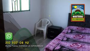 Postel nebo postele na pokoji v ubytování Hostal Montañas Colombianas