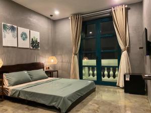 Ένα ή περισσότερα κρεβάτια σε δωμάτιο στο Amara PhuQuoc Hotel