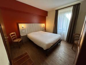 Postel nebo postele na pokoji v ubytování Auberge Des Mésanges