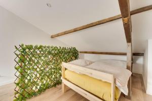 Posteľ alebo postele v izbe v ubytovaní Duplex Moderne Cosy - Proche Porte d'Italie - Parking