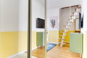 Televízia a/alebo spoločenská miestnosť v ubytovaní Duplex Moderne Cosy - Proche Porte d'Italie - Parking
