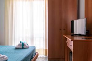 Postel nebo postele na pokoji v ubytování Hotel Alisei