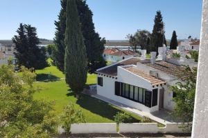 an aerial view of a white house with a yard at My cozy BEACH HOUSE in Tavira