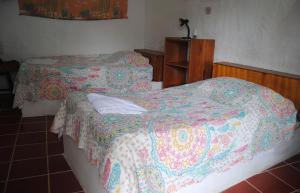 Voodi või voodid majutusasutuse Hostal Galapagos by Bar de Beto toas