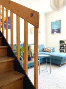 a living room with a couch and a table at La Mariennée in La Rochelle +31 photos
