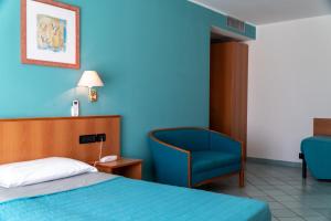 Postel nebo postele na pokoji v ubytování Hotel Alisei