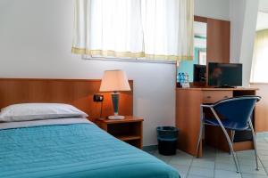 Postel nebo postele na pokoji v ubytování Hotel Alisei