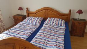 Ein Bett oder Betten in einem Zimmer der Unterkunft Ferienwohnungen Brasse