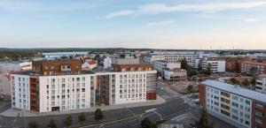 an aerial view of a city with buildings at Snowflake suites V in Rovaniemi