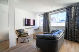 Μια τηλεόραση ή/και κέντρο ψυχαγωγίας στο Le Boudoir du Palais Climatisé & Luxueux +7 φωτογραφίες