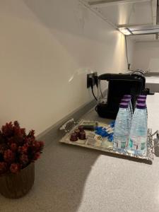 two bottles of water sitting on top of a counter at Amazing apartment in Riyadh +5 photos