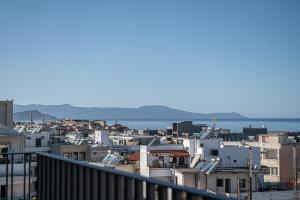 a view of a city from a balcony at Sea & Sun Penthouse in Chania