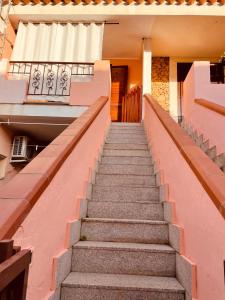 a set of stairs leading to a building at Casa Jane in Villasimius