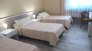 Postel nebo postele na pokoji v ubytování Hotel Al Sant'Andrea