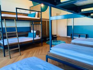 a room with three bunk beds in it at Grand Hostel Berlin Classic in Berlin