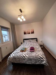 Cama ou camas em um quarto em Apartament Star