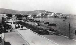 a black and white photo of a body of water with boats at Pandrossos Hotel - Paros in Parikia