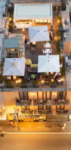 an overhead view of a building with tables and umbrellas at Hotel Sorrento City in Sorrento