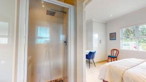 Voodi või voodid majutusasutuse Rose Cottage in Caribbean Estate toas