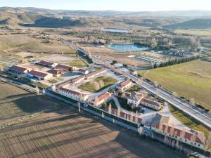 an aerial view of a train station and a town at Hostal Las Paneras in Ávila