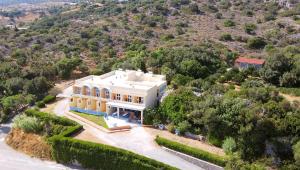an aerial view of a large white house at Phoenix-Hotel in Plakias