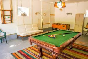 a living room with a pool table and a couch at Steve's Sweet Spot - UP Adventure Getaway in Silver City