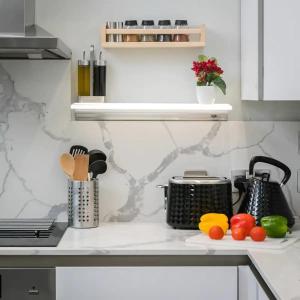 a kitchen counter with fruits and vegetables on it at Modern 3 and 2 bedroom flat in central london with full AC in London