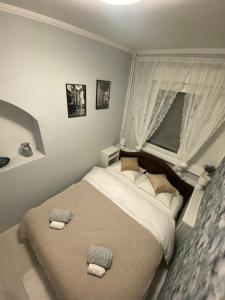 a bedroom with a bed with two towels on it at Apartman Kali in Banja Luka