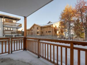 a view from the balcony of a house at Appartement rénové au cœur de l'Alpe d'Huez avec Wifi et Parking - FR-1-645-24 in LʼHuez