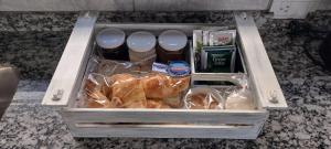a drawer filled with food and drinks on a counter at Apartamento Agur cerca del Arena Stadium in Maipú