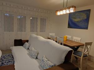 a living room with a couch and a table at Apartamento playa de Chancelas, Pontevedra in Combarro