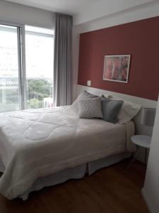 Кровать или кровати в номере Loft Moderno, com garagem apto 1106