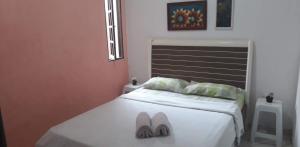 Ένα ή περισσότερα κρεβάτια σε δωμάτιο στο Casa de praia em São Pedro da Aldeia