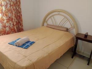 เตียงในห้องที่ Casa de praia em São Pedro da Aldeia