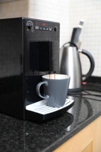 Coffee and tea making facilities at Casa corasol, a cozy, comfy, 2BR house- panoramic view and rooftop