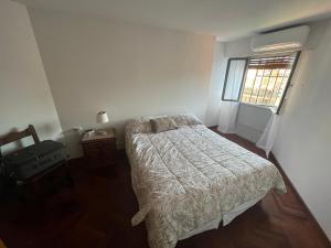 En eller flere senge i et værelse på Departamento amoblado Nueva Córdoba