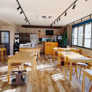 a restaurant with tables and chairs and a kitchen at Cate no mori - Vacation STAY 16675v in Shime