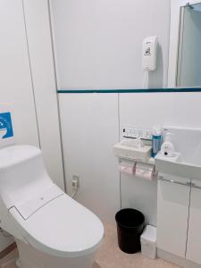 a white bathroom with a toilet and a mirror at Cate no mori - Vacation STAY 16675v in Shime