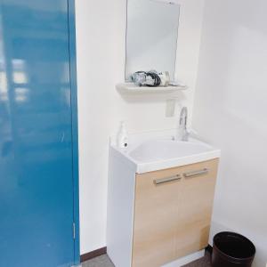 a bathroom with a sink and a mirror at Cate no mori - Vacation STAY 16675v in Shime