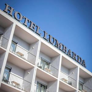 a hotel sign on the side of a building at Hotel Lumbarda in Lumbarda
