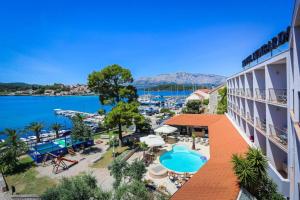 an image of a hotel with a view of the water at Hotel Lumbarda in Lumbarda