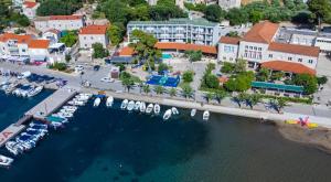 an aerial view of a marina with boats in the water at Hotel Lumbarda in Lumbarda