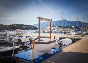 a boat is docked in a marina with other boats at Hotel Lumbarda in Lumbarda