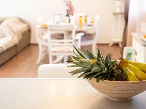 a bowl of pineapple and bananas on a table at Euphoria Country House in Agios Ioannis