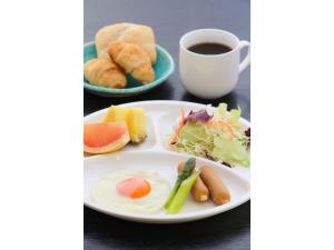a plate of breakfast foods and a cup of coffee at Kusatsu Onsen 326 Yamanoyu Hotel - Vacation STAY 10349v in Kusatsu +22 photos
