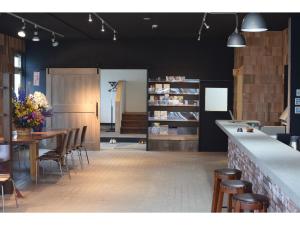 a dining room with a table and some chairs at Noboribetsu Guest House AKA and AO - Vacation STAY 20484v in Noboribetsu