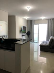 TV a/nebo společenská místnost v ubytování Apartamento Gratidão