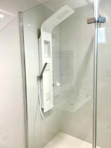 a shower with a glass door in a bathroom at The Quay in Newhaven