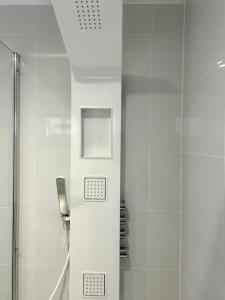 a shower in a bathroom with a glass door at The Quay in Newhaven